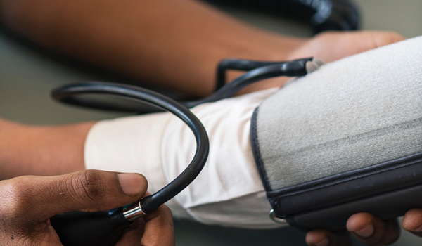 a person having their blood pressure taken